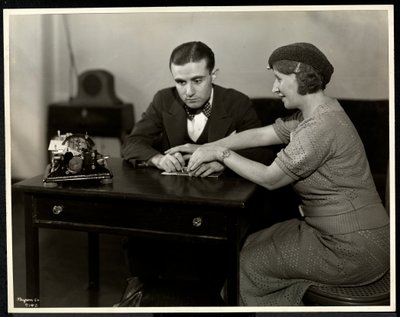 Woman Teaching a Blind Man to Read Braille at the New York Association for the Blind by Byron Company
